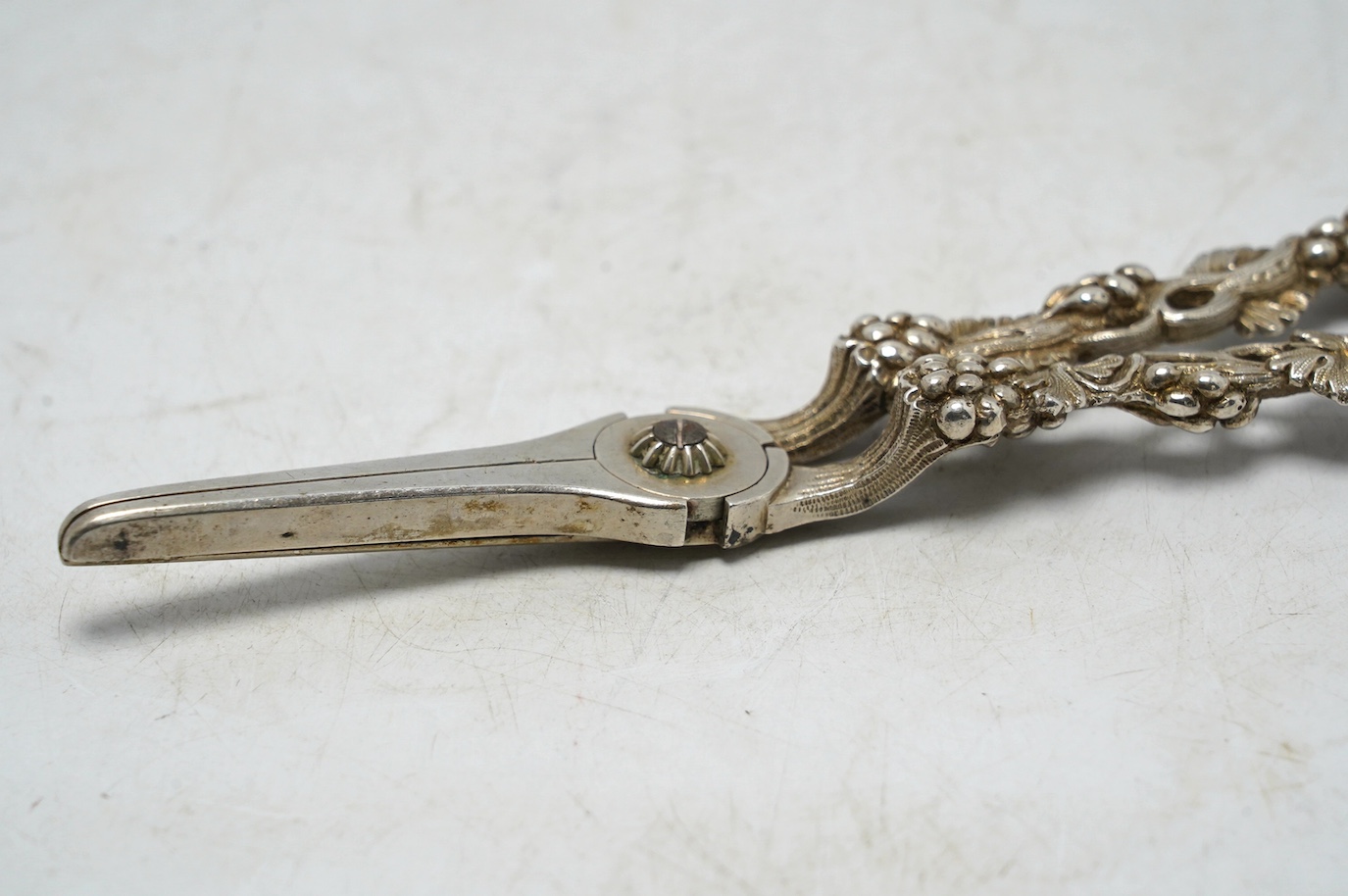 A pair of late Victorian silver grape shears, with fruiting vine handles, by William Summers, London, 1879, 18.9cm. Condition - fair to good